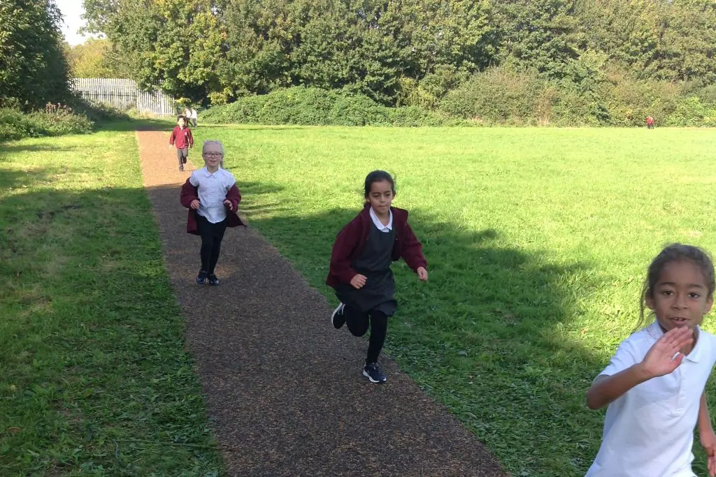 Children running on a Daily Mile Track