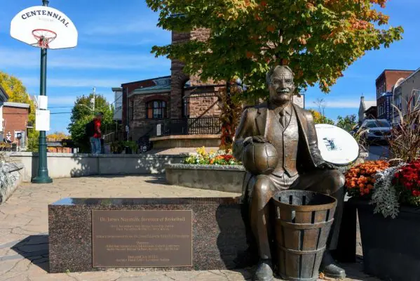 A commerative statue of the inventor of basketball Dr James Naismith.