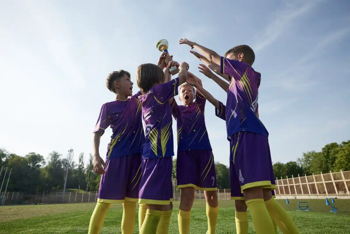 School boys playing football