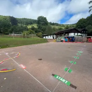 Playground at a primary school wiht multiple different playground markings designs on