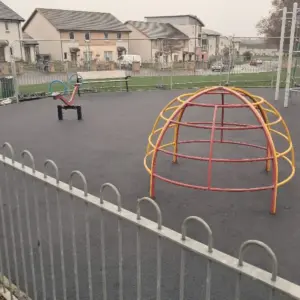 Play park with black wetpour surfacing
