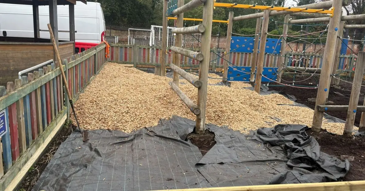 During the installation of installing play bark around equipment